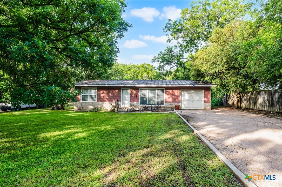 2052 Gruene Road New Braunfels, TX 78130 - Photo 2 of 33 a view of a yard with a house and a garden