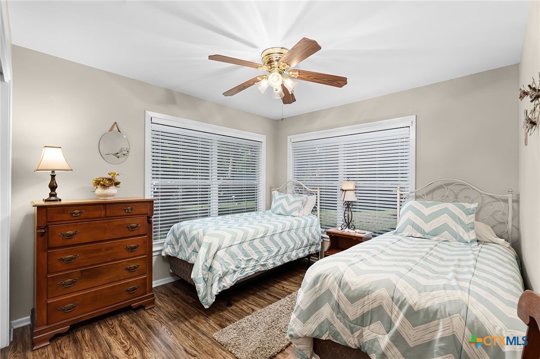 2052 Gruene Road New Braunfels, TX 78130 - Photo 21 of 33 a bedroom with two beds and windows