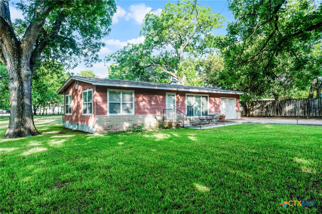 2052 Gruene Road New Braunfels, TX 78130 - Photo 3 of 33 a view of a house with backyard and a tree