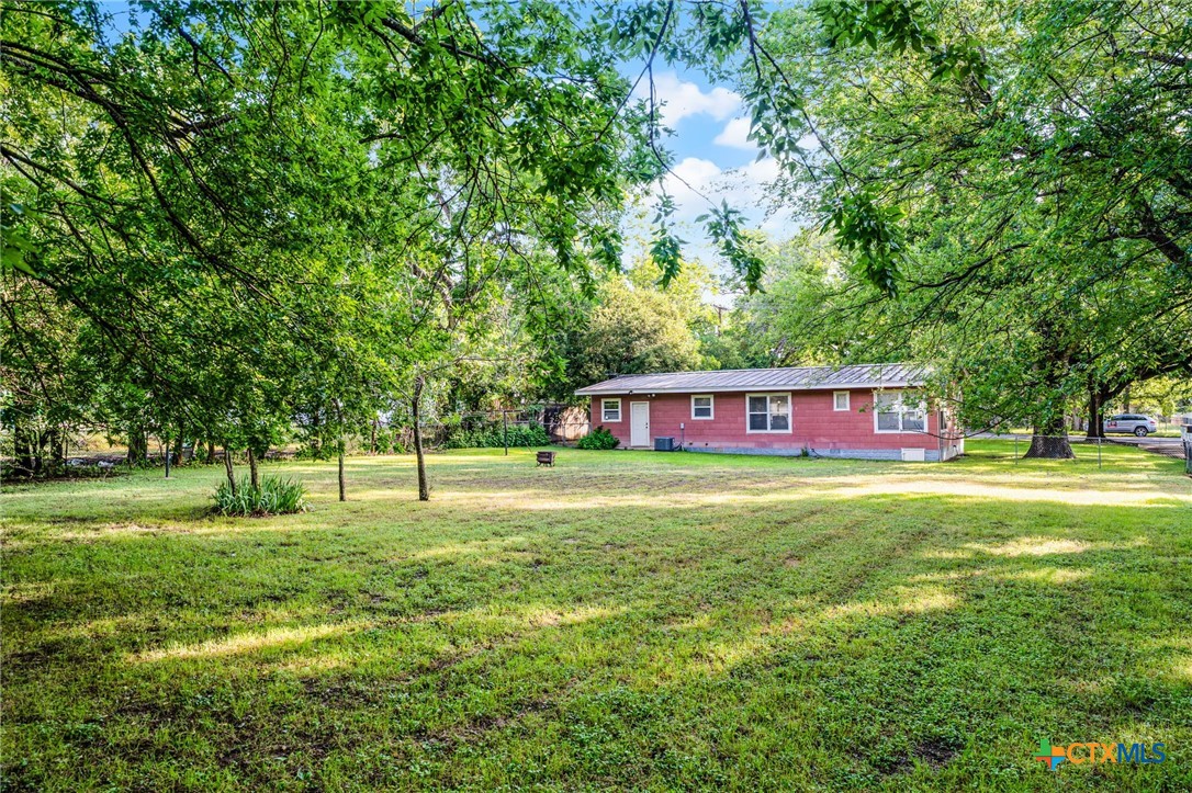 2052 Gruene Road New Braunfels, TX 78130 - Photo 9 of 33 a view of a big yard with a house in the background