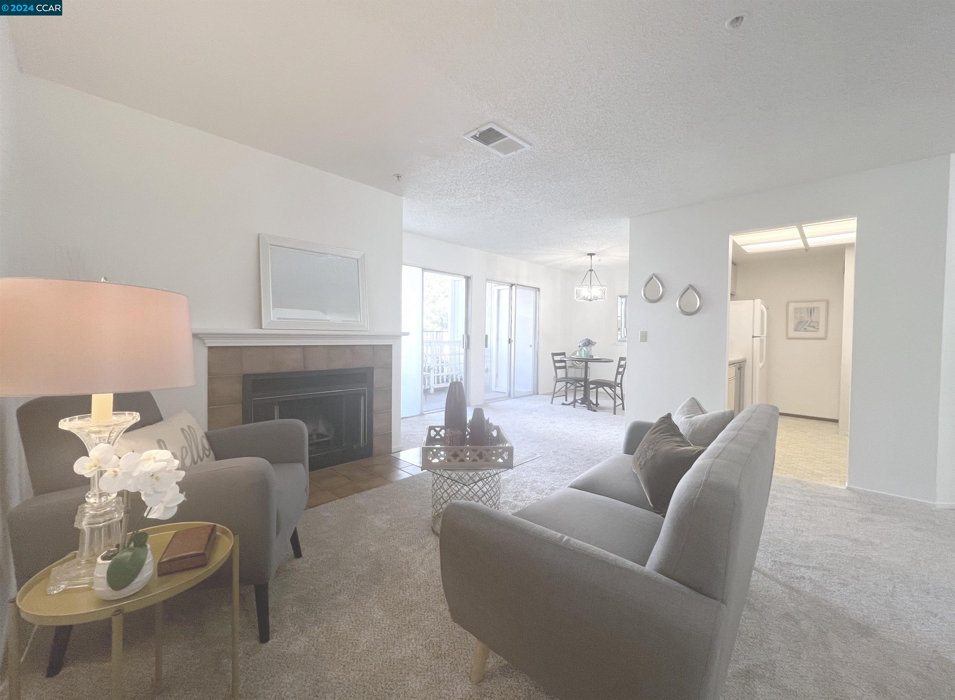 2709 Oak Road, Unit D Walnut Creek, CA 94597 - Photo 1 of 1 a living room with furniture and a fireplace