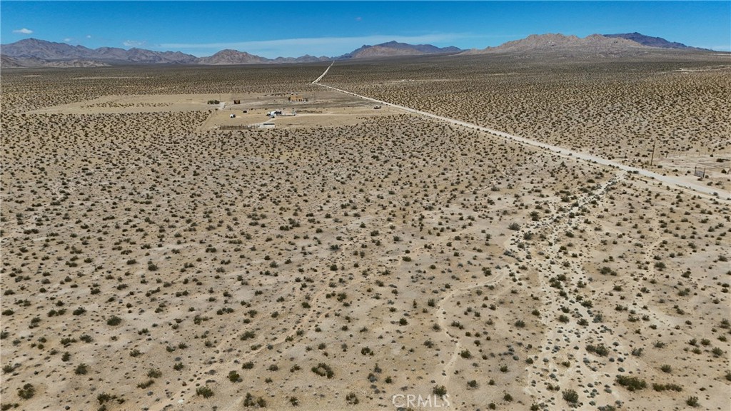 727 Harrod Road Lucerne Valley, CA 92356 - Photo 3 of 11 Red boundary lines on pictures are an estimate and for marketing purposes only. Buyer to verify all aspects of this property including, but not limited to utilities, assessments, boundaries, usage, access, and zoning to satisfy themselves.