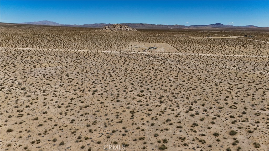 727 Harrod Road Lucerne Valley, CA 92356 - Photo 5 of 11 Red boundary lines on pictures are an estimate and for marketing purposes only. Buyer to verify all aspects of this property including, but not limited to utilities, assessments, boundaries, usage, access, and zoning to satisfy themselves.