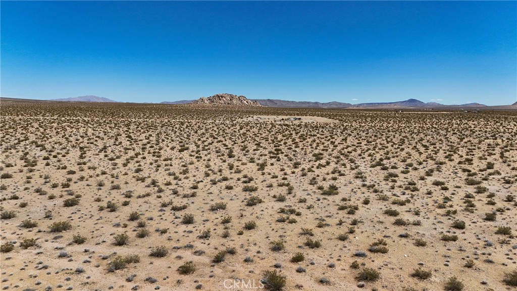 727 Harrod Road Lucerne Valley, CA 92356 - Photo 6 of 11 Red boundary lines on pictures are an estimate and for marketing purposes only. Buyer to verify all aspects of this property including, but not limited to utilities, assessments, boundaries, usage, access, and zoning to satisfy themselves.