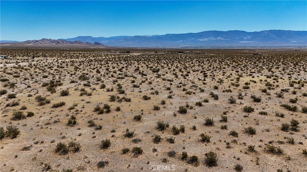 727 Harrod Road Lucerne Valley, CA 92356 - Photo 9 of 11 Red boundary lines on pictures are an estimate and for marketing purposes only. Buyer to verify all aspects of this property including, but not limited to utilities, assessments, boundaries, usage, access, and zoning to satisfy themselves.