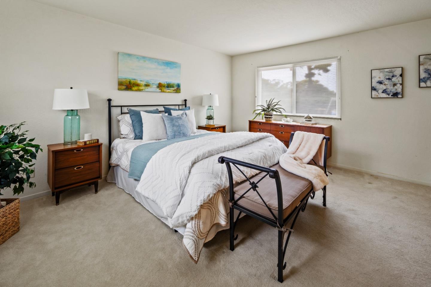 1088 Indian Village Road Pebble Beach, CA 93953 - Photo 15 of 22 a bedroom with a bed chair and painting on the wall