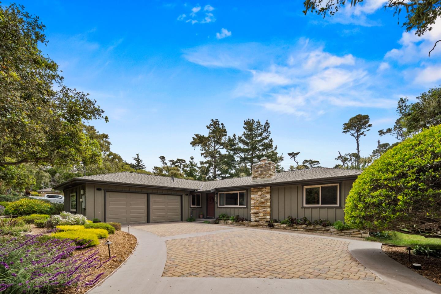 1088 Indian Village Road Pebble Beach, CA 93953 - Photo 22 of 22 a front view of a house with a yard and garage