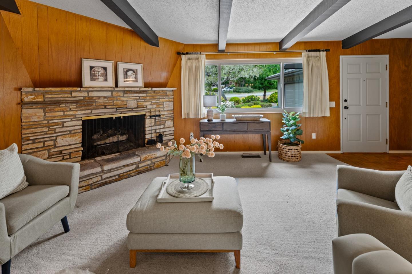 1088 Indian Village Road Pebble Beach, CA 93953 - Photo 4 of 22 a living room with furniture a fireplace and a large window