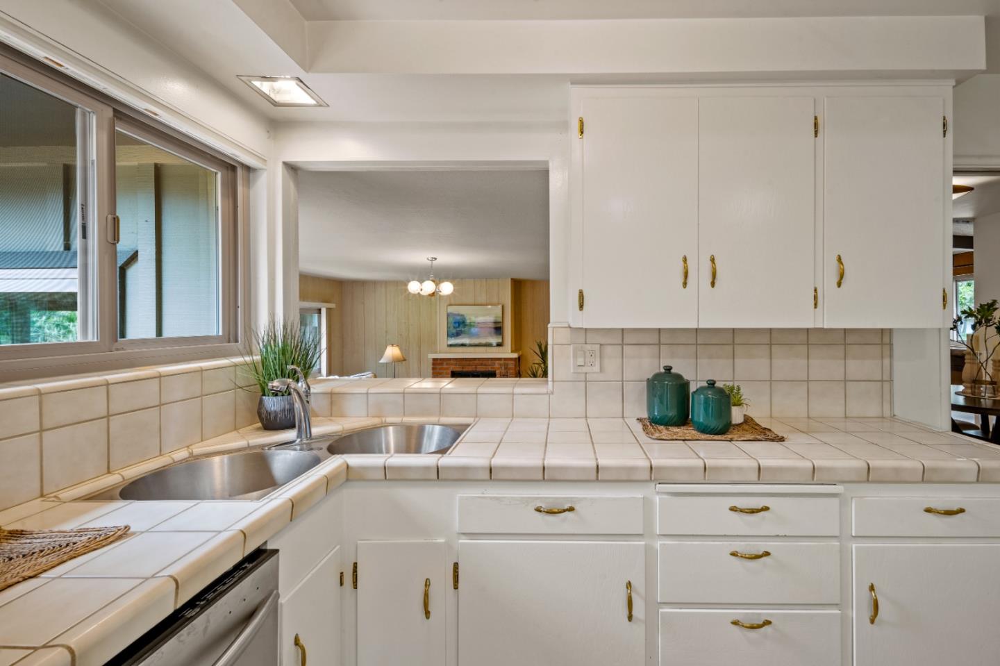 1088 Indian Village Road Pebble Beach, CA 93953 - Photo 9 of 22 a kitchen with a sink and cabinets