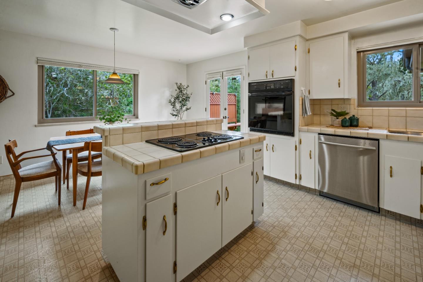 1088 Indian Village Road Pebble Beach, CA 93953 - Photo 10 of 22 a kitchen with granite countertop a sink stove and refrigerator