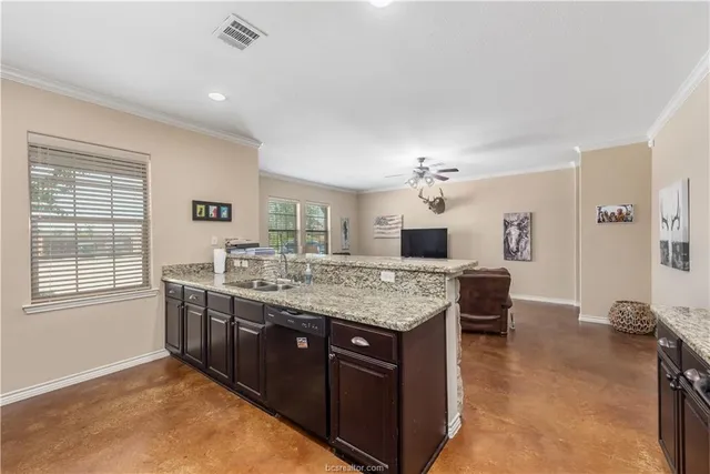 a kitchen with a stove and a sink
