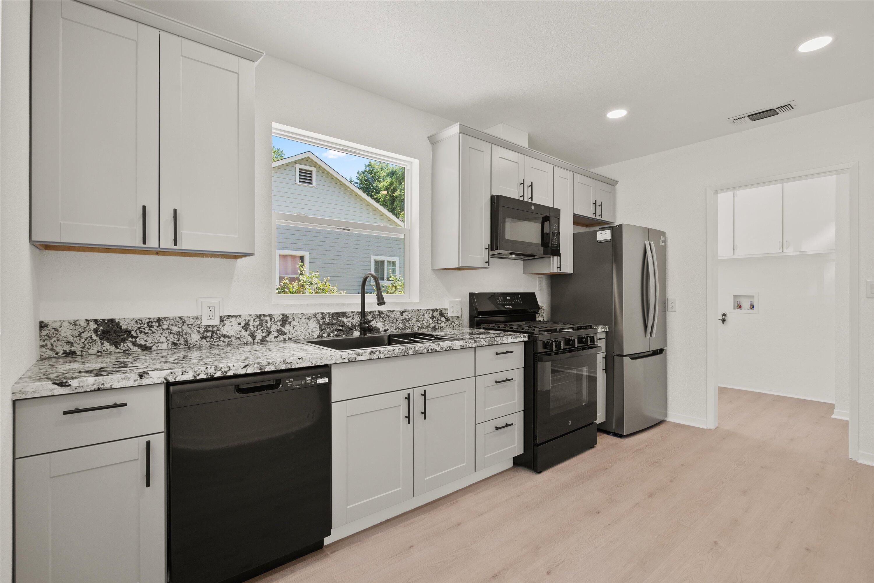 1709 Arcadian Avenue Chico, CA 95926 - Photo 17 of 33 a kitchen with a sink stove and refrigerator