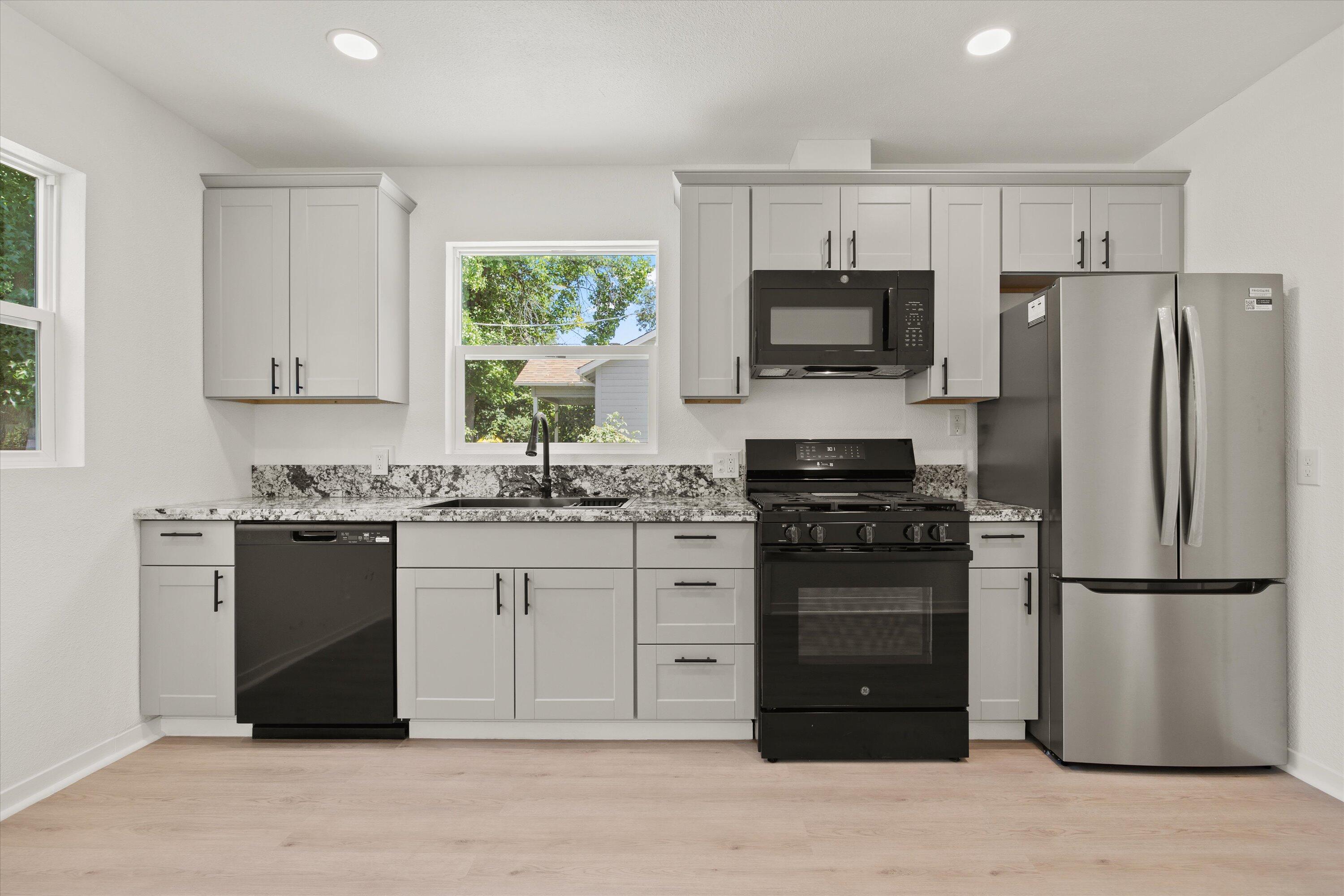 1709 Arcadian Avenue Chico, CA 95926 - Photo 18 of 33 a kitchen with a refrigerator stove and microwave