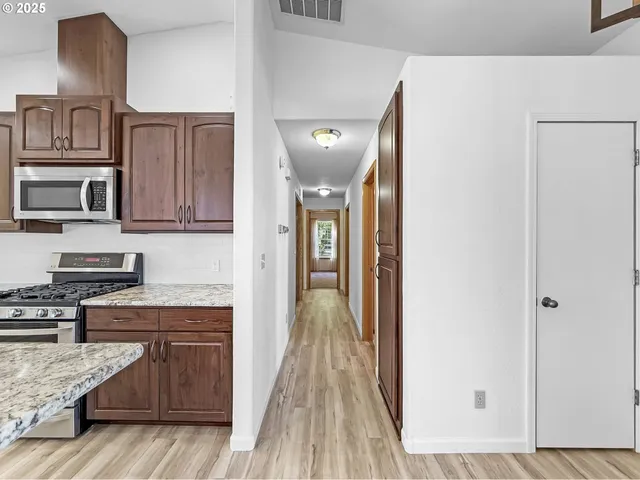 a view of a kitchen from the hallway