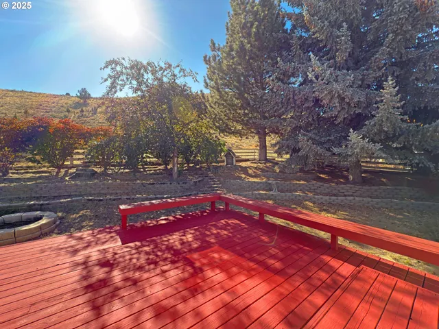 a view of outdoor space with deck and yard