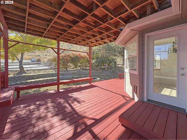 a patio with wooden floor