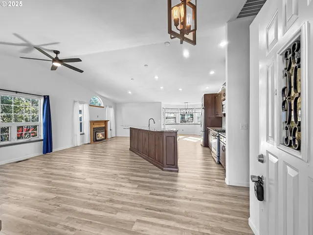a view of kitchen and dining room with wooden floor