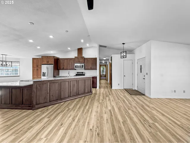 a view of kitchen with wooden floor
