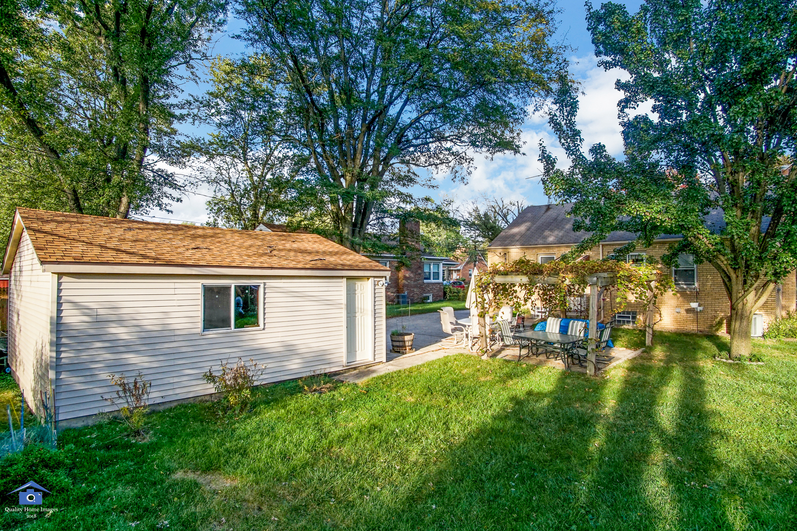 18450 Homewood Avenue Homewood, IL 60430 - Photo 17 of 20 a backyard of a house with table and chairs