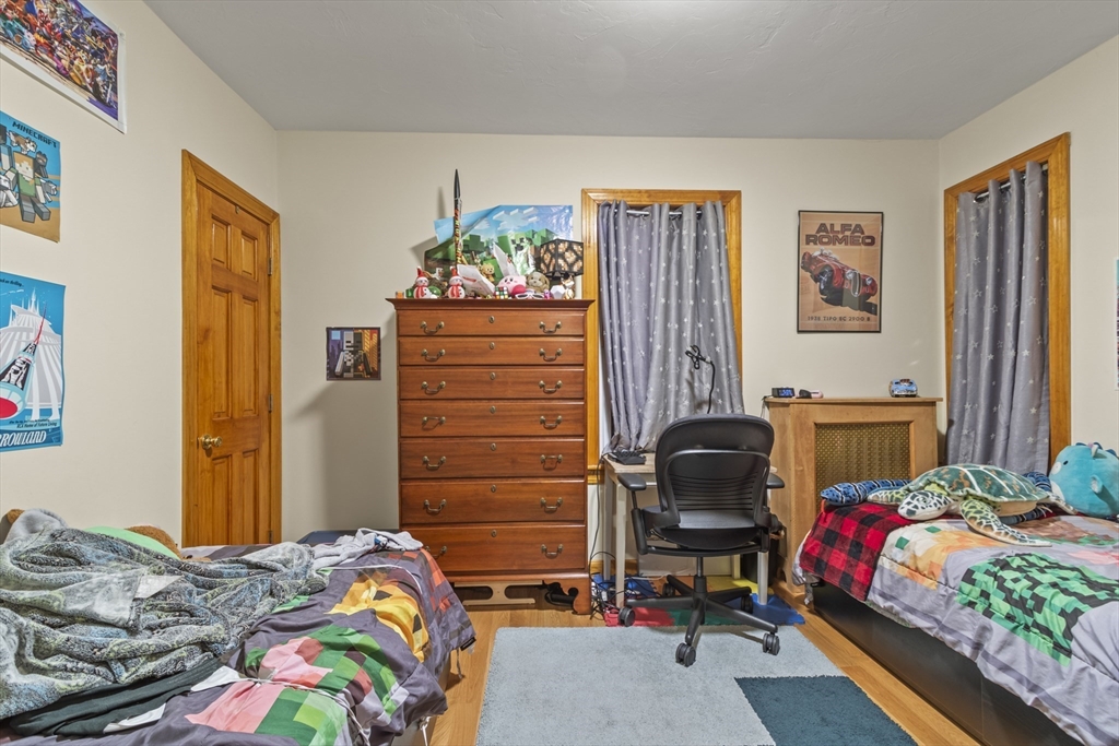 74 Forest Street Whitman, MA 02382 - Photo 11 of 32 a bedroom with a bed and furniture