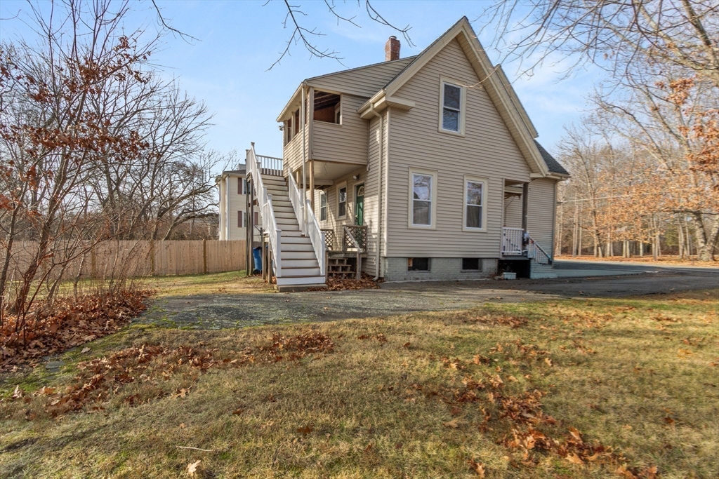 74 Forest Street Whitman, MA 02382 - Photo 27 of 32 a view of a house with a yard covered in snow