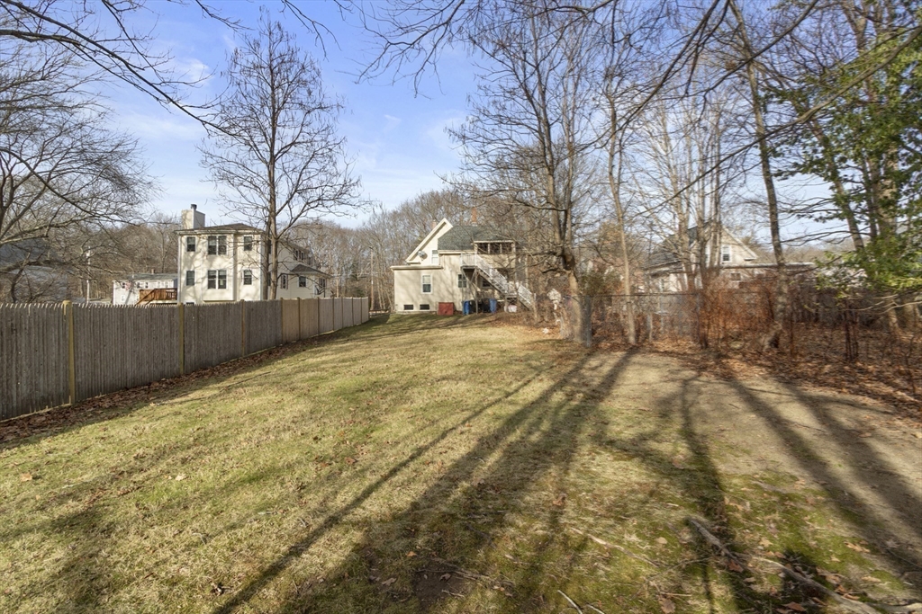 74 Forest Street Whitman, MA 02382 - Photo 28 of 32 a view of a yard with snow on the road