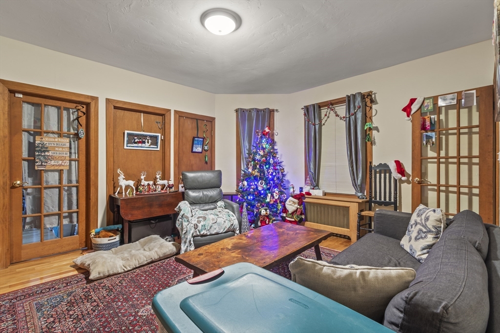 74 Forest Street Whitman, MA 02382 - Photo 4 of 32 a living room with furniture and a potted plant