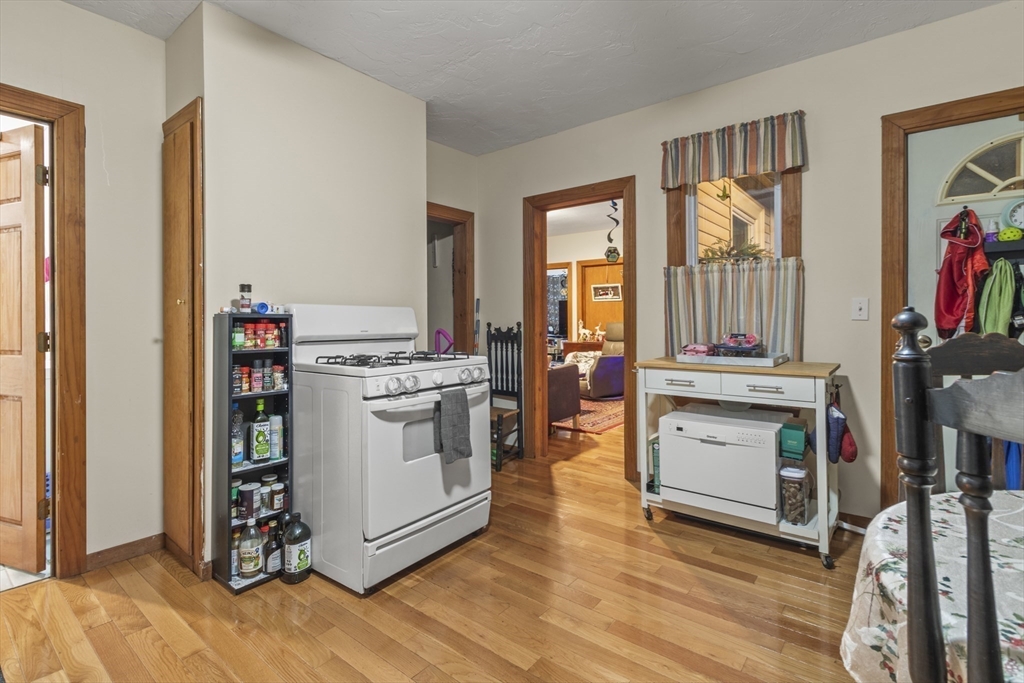 74 Forest Street Whitman, MA 02382 - Photo 6 of 32 a kitchen with stainless steel appliances a stove and a refrigerator