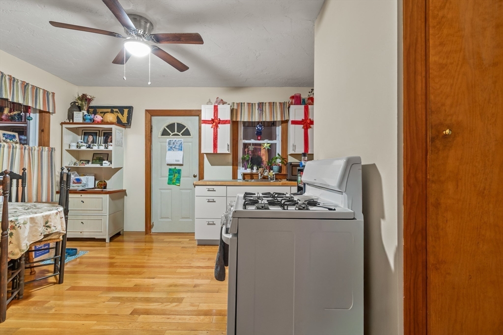 74 Forest Street Whitman, MA 02382 - Photo 8 of 32 a kitchen with stainless steel appliances granite countertop a refrigerator and a stove top oven