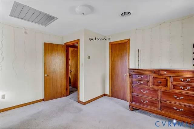 a view of room with wooden closet