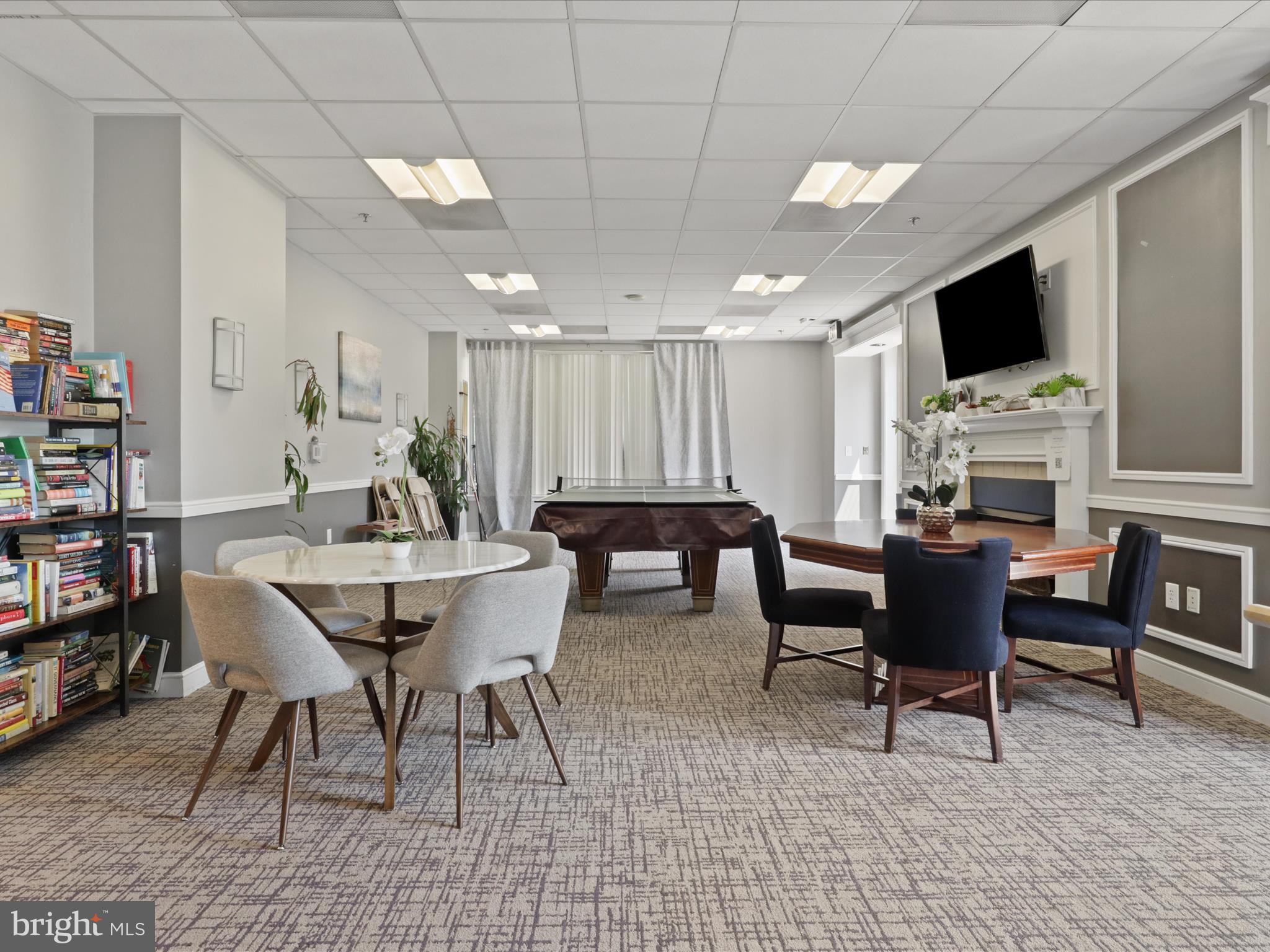 2726 Gallows Road, Unit 411 Vienna, VA 22180 - Photo 28 of 36 a view of a dining room with furniture