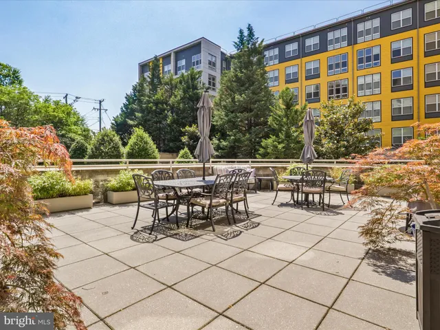 a view of a chairs and table in a patio