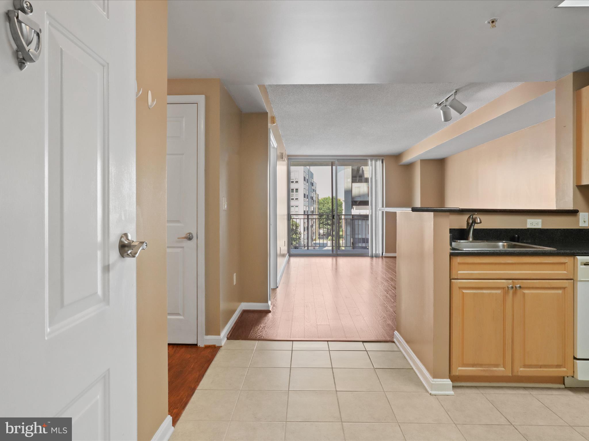 2726 Gallows Road, Unit 411 Vienna, VA 22180 - Photo 5 of 36 a view of a kitchen with refrigerator and windows