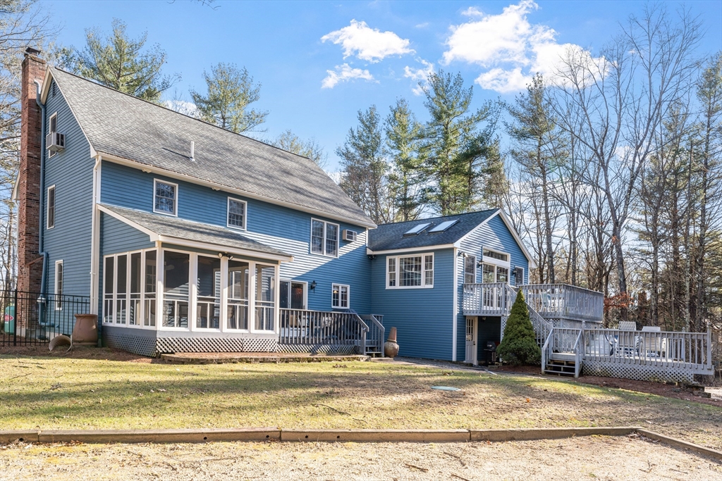 24 New Road Windham, NH 03087 - Photo 4 of 31 a view of a house with a swimming pool and sitting area