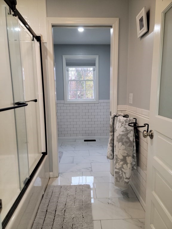 66 Vincent Circle Worcester, MA 01604 - Photo 18 of 40 a bathroom with a glass door shower
