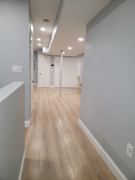 66 Vincent Circle Worcester, MA 01604 - Photo 24 of 40 an empty room with wooden floor and windows