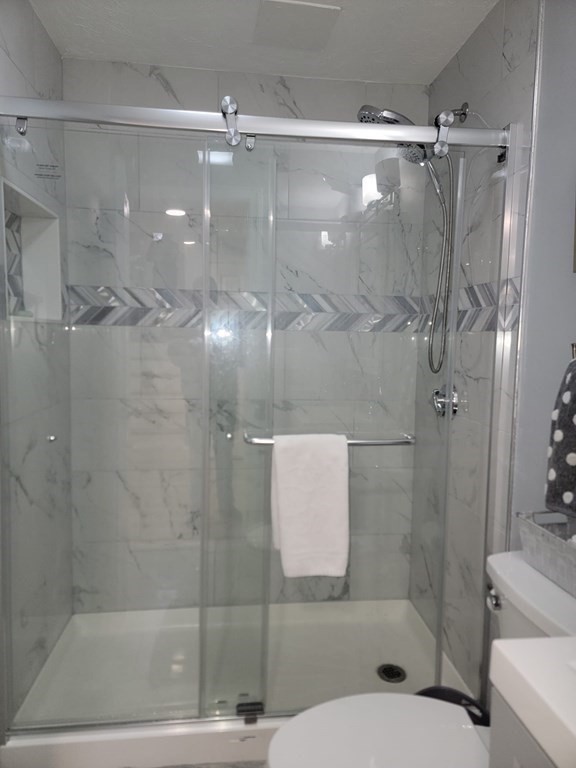 66 Vincent Circle Worcester, MA 01604 - Photo 30 of 40 a bathroom with a shower and a toilet
