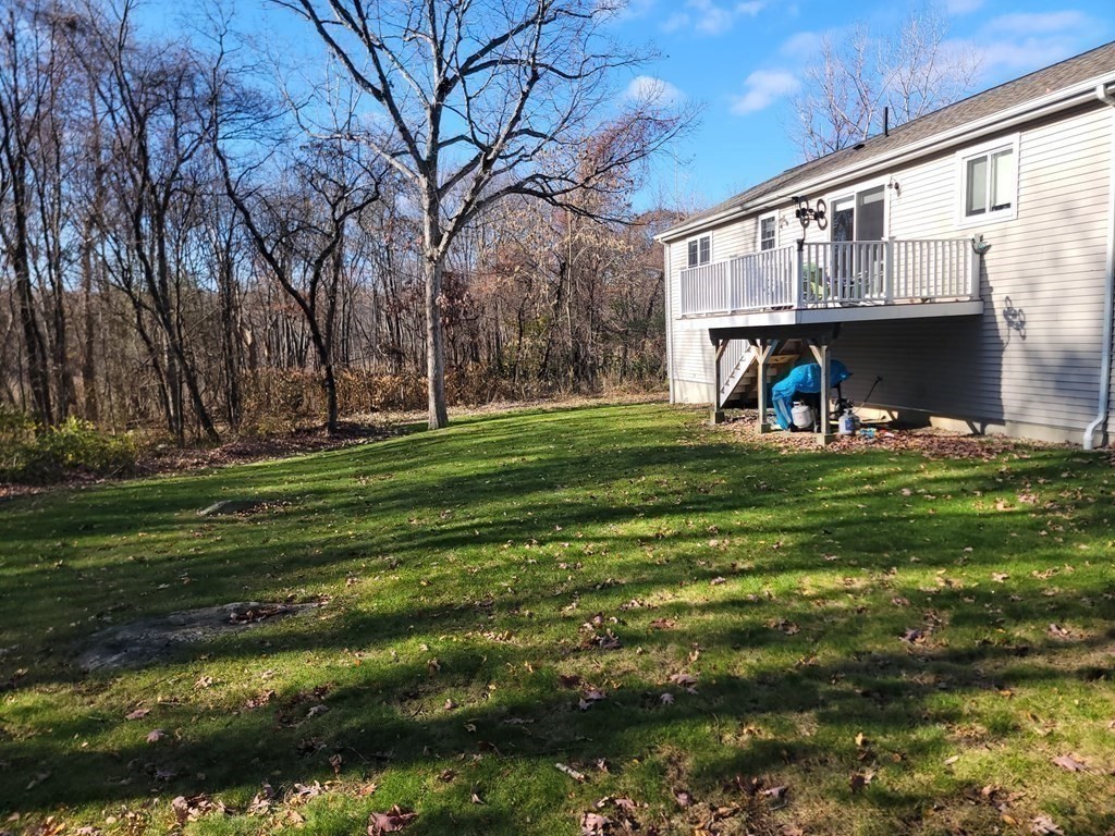 66 Vincent Circle Worcester, MA 01604 - Photo 35 of 40 a view of a big house with a big yard and large trees