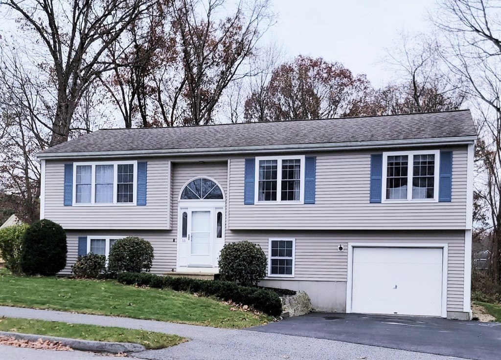 66 Vincent Circle Worcester, MA 01604 - Photo 4 of 40 a front view of a house with a garden
