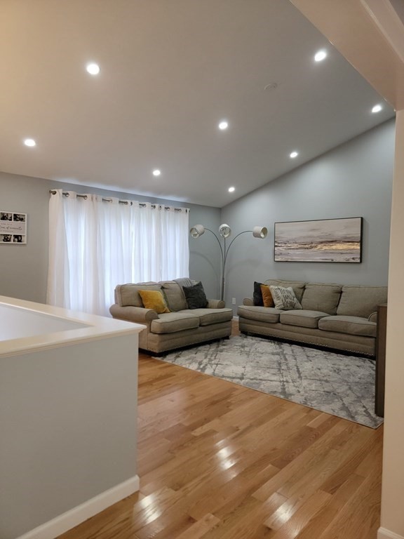 66 Vincent Circle Worcester, MA 01604 - Photo 6 of 40 a living room with furniture and a wooden floor