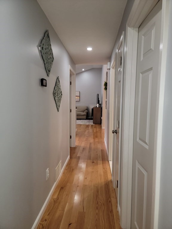 66 Vincent Circle Worcester, MA 01604 - Photo 8 of 40 a view of a hallway with wooden floor