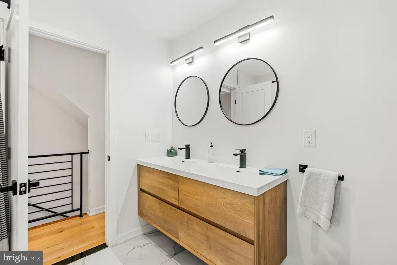 936 Tasker Street Philadelphia, PA 19148 - Photo 12 of 17 a bathroom with a sink and a mirror