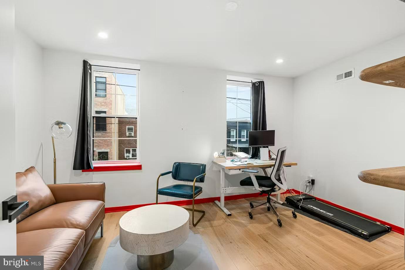 936 Tasker Street Philadelphia, PA 19148 - Photo 13 of 17 a view of a livingroom with workspace and a couch
