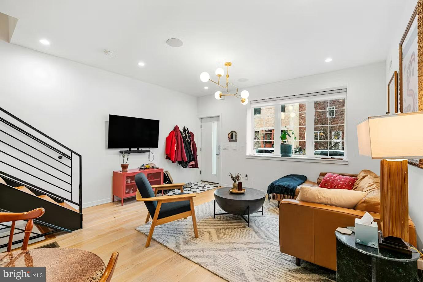 936 Tasker Street Philadelphia, PA 19148 - Photo 3 of 17 a living room with furniture and a flat screen tv