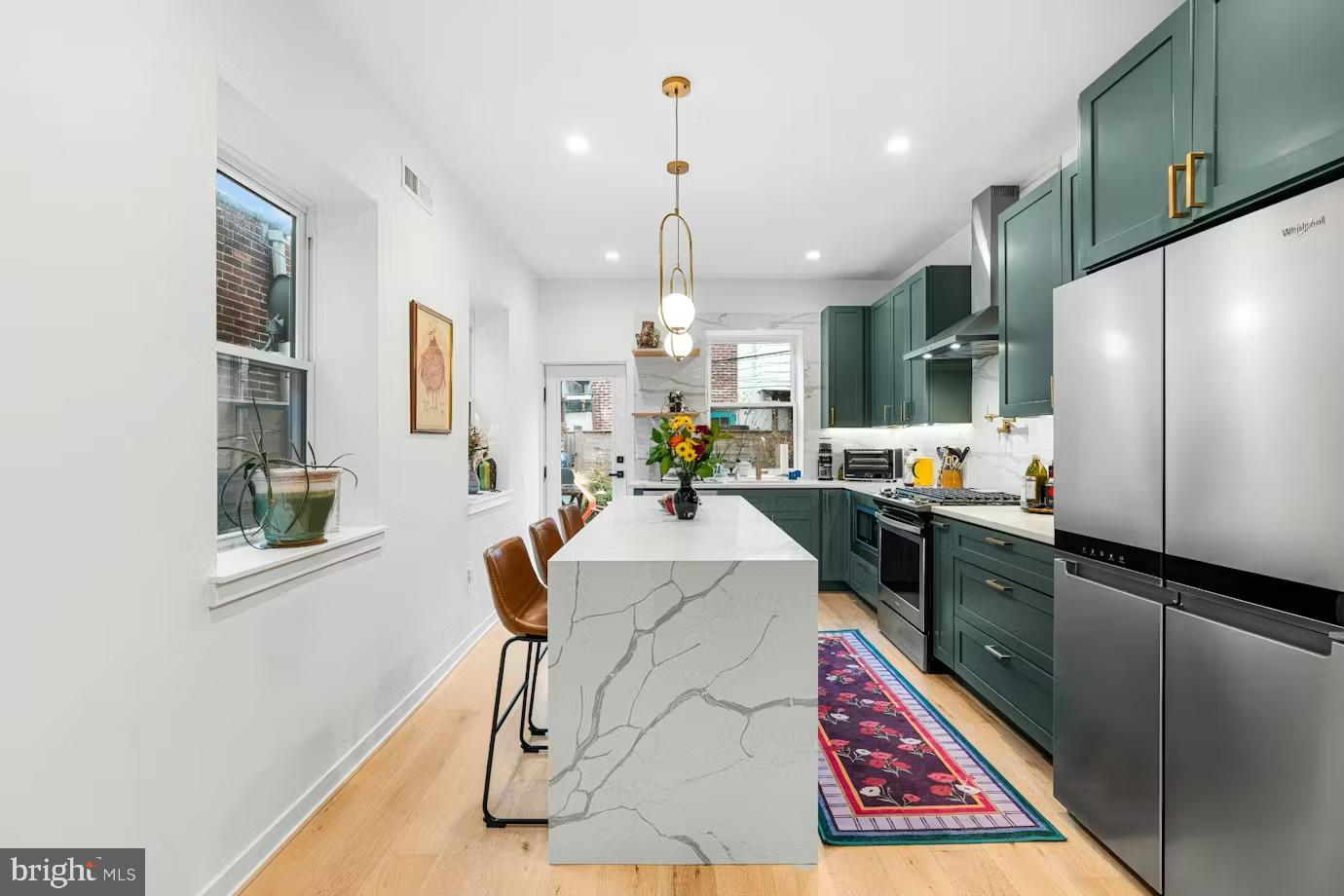 936 Tasker Street Philadelphia, PA 19148 - Photo 5 of 17 a very nice looking kitchen with granite countertop a stove a sink dishwasher and a refrigerator
