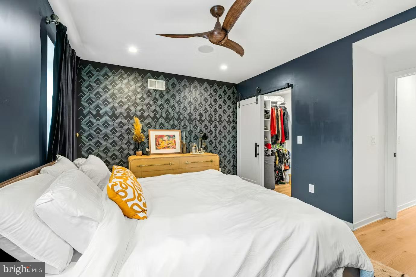 936 Tasker Street Philadelphia, PA 19148 - Photo 6 of 17 a bedroom with a bed and a large mirror