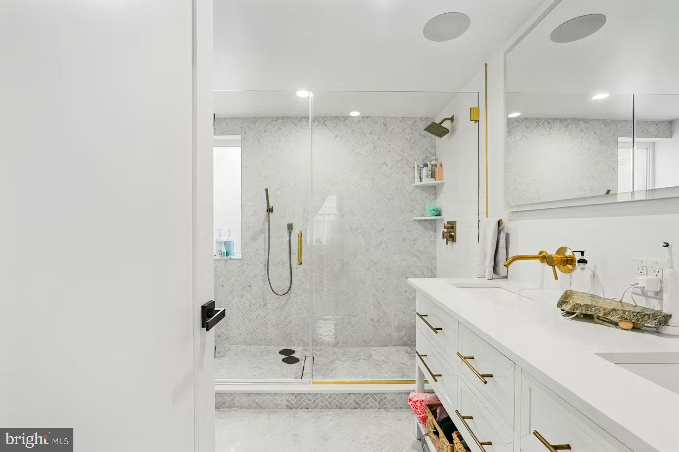 936 Tasker Street Philadelphia, PA 19148 - Photo 9 of 17 a bathroom with a tub sink vanity and mirror