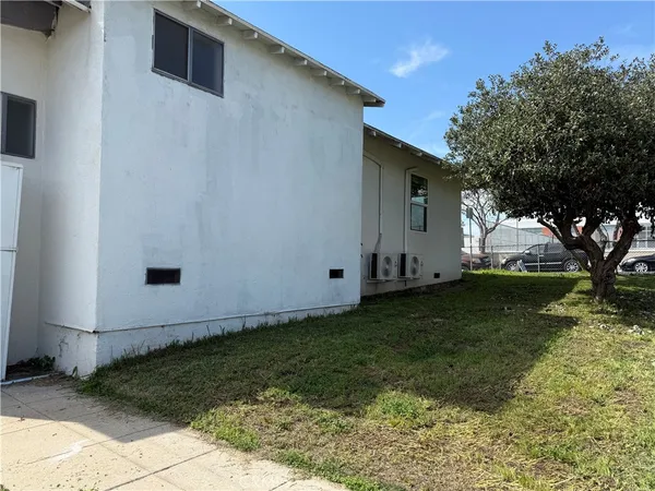 a view of a backyard with large trees