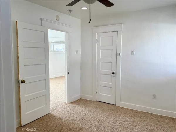 an empty room with fan