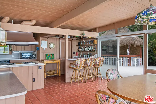 a bathroom with a granite countertop window a sink and a vanity